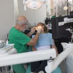 Patient at dentist surgery under lighting