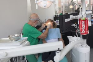 Patient at dentist surgery under lighting