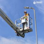 Smart Electrics founder in a cherry picker crane working on street lighting
